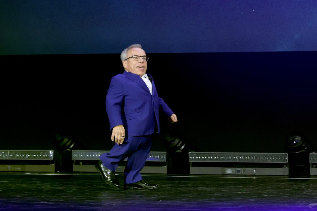 ANAHEIM, CALIFORNIA - SEPTEMBER 10: Warwick Davis speaks onstage during D23 Expo 2022 at Anaheim Convention Center in Anaheim, California on September 10, 2022. (Photo by Jesse Grant/Getty Images for Disney)