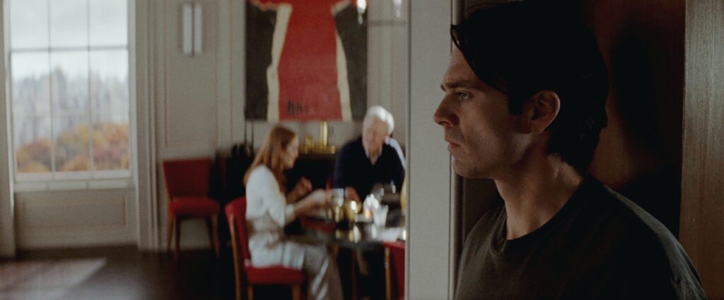 Sebastian Stan, Julianne Moore and John Lithgow in "Sharper," premiering February 17, 2023 on Apple TV+.