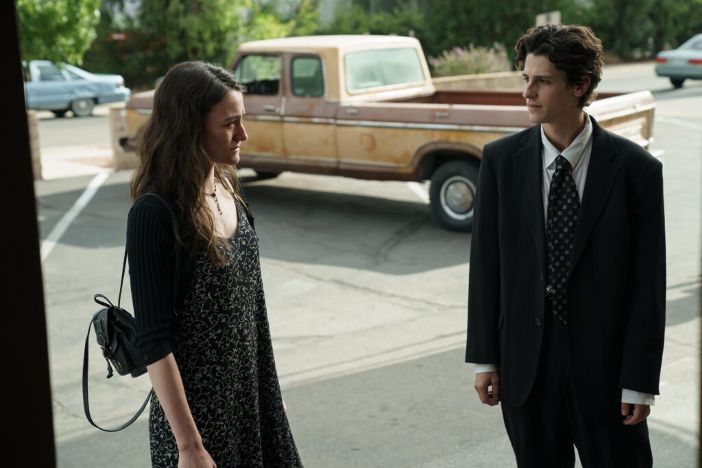 Tiny Beautiful Things -- “Yours, Sugar” - Episode 102 -- Clare grapples with whether or not she wants to become Sugar as she reels from trouble at work and with Rae. In the past, Young Clare and Young Lucas must confront their grief at Frankie’s funeral. If Clare can’t figure out her own life, can she be Sugar? Young Clare (Sarah Pidgeon,) and Young Lucas (Owen Painter), shown. (Photo by: Elizabeth Morris/Hulu) - Episodic Stills
