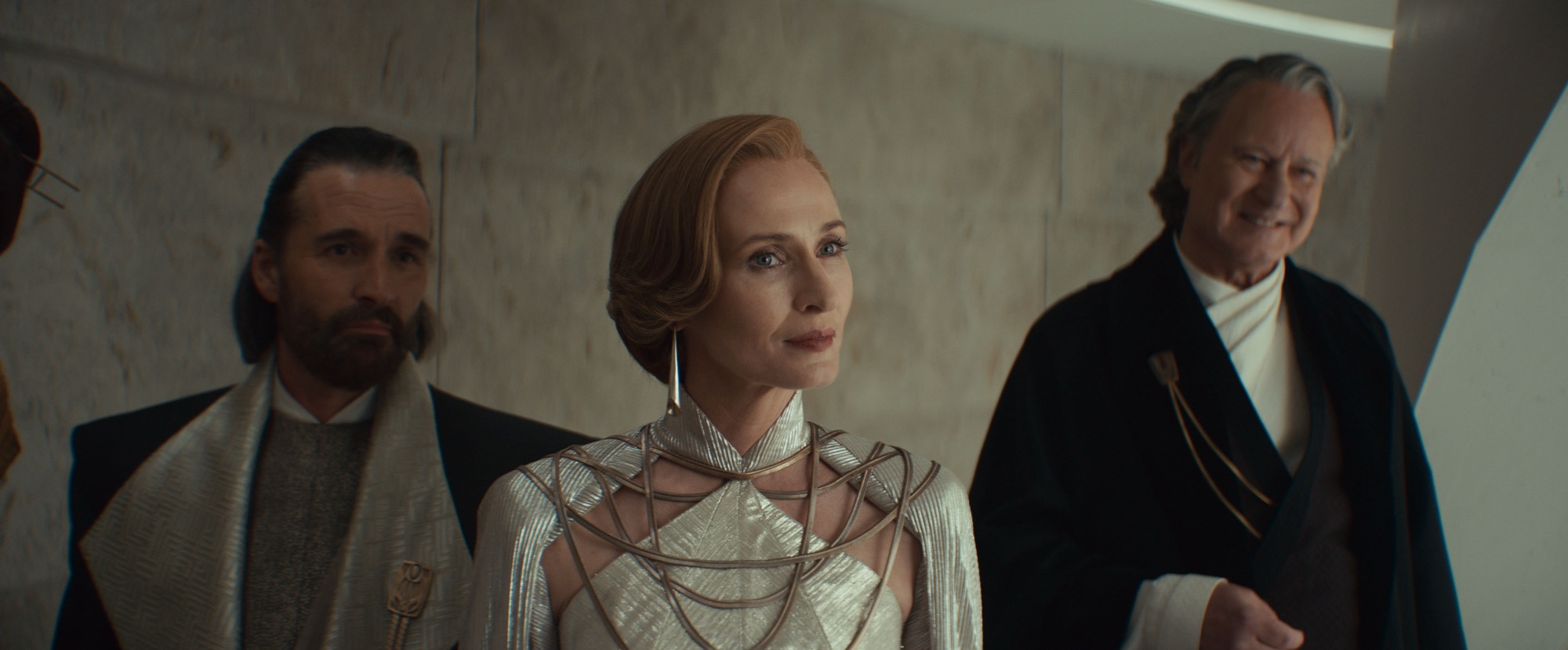 (L-R) Perrin Fertha (Allistair Mackenzie), Mon Mothma (Genevieve O'Reilly) and Luthen Rael (Stellan Skarsgård) in Lucasfilm's ANDOR Season 2, exclusively on Disney+. Photo courtesy of Lucasfilm. ©2025 Lucasfilm Ltd. & TM. All Rights Reserved.
