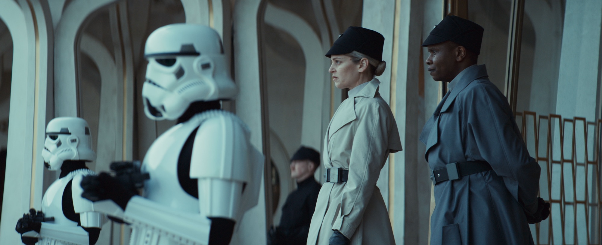 (Second from Left - R) Dedra Meero (Denise Gough) and Grymish (Kurt Egyiawan) in Lucasfilm's ANDOR Season 2, exclusively on Disney+. ©2025 Lucasfilm Ltd. & TM. All Rights Reserved.