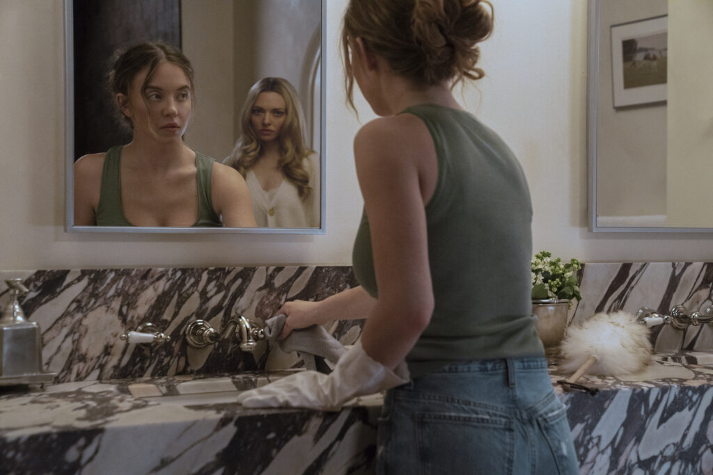 Sydney Sweeney as Millie and Amanda Seyfried as Nina in The Housemaid. Photo Credit: Daniel McFadden/Lionsgate
