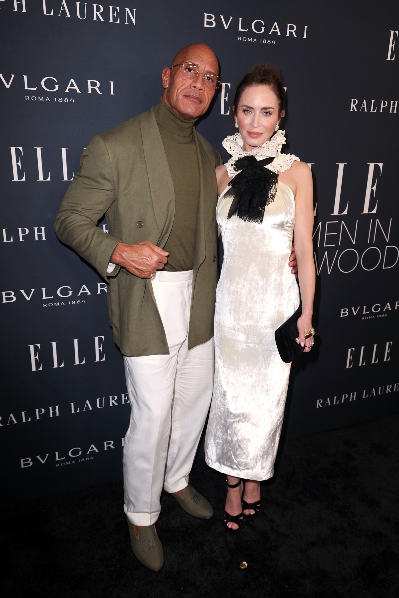 LOS ANGELES, CALIFORNIA - NOVEMBER 17: (L-R) Dwayne Johnson, wearing Ralph Lauren, and Emily Blunt, wearing Ralph Lauren and Bvlgari, attend ELLE's 2025 Women in Hollywood Celebration presented by Ralph Lauren and Bvlgari with support from evian, Hendrick's Gin, and Lucid Motors on November 17, 2025 in Los Angeles, California. (Photo by Joe Scarnici/Getty Images for ELLE)