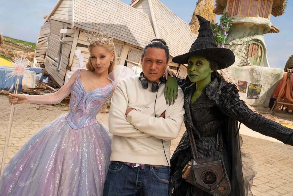 Ariana Grande (as Glinda), director Jon M. Chu, and Cynthia Erivo (as Elphaba), on the set of 'Wicked: For Good'