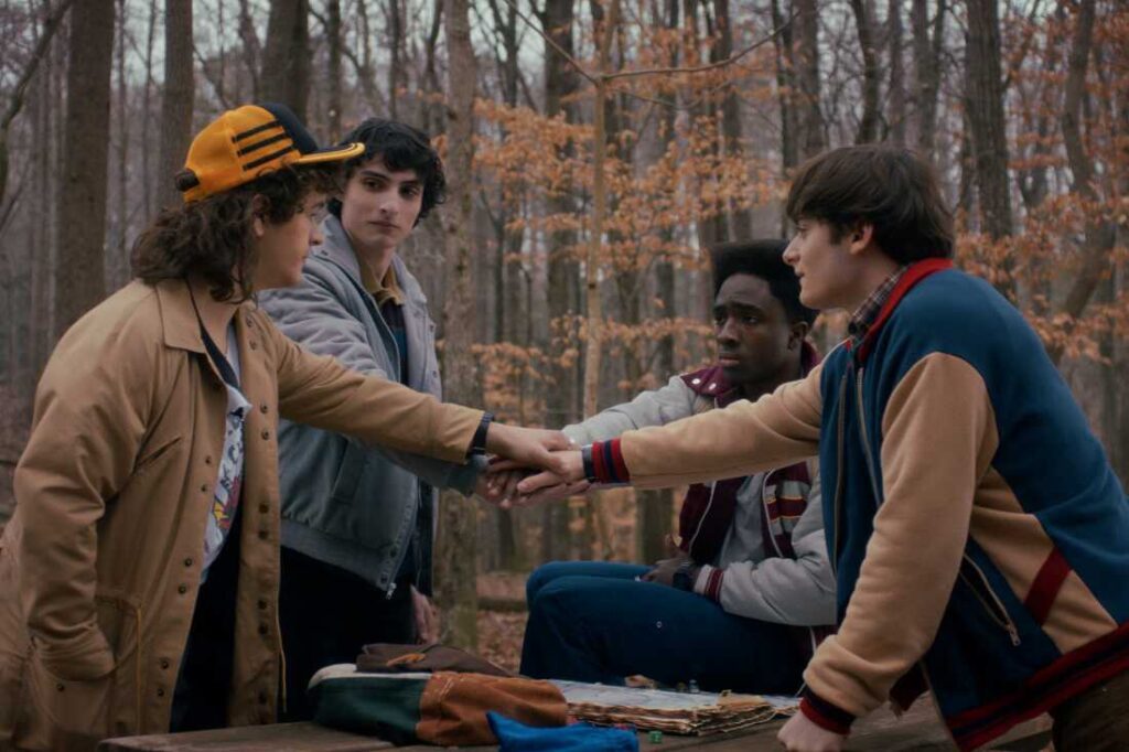 STRANGER THINGS: SEASON 5. (L to R) Gaten Matarazzo as Dustin Henderson, Finn Wolfhard as Mike Wheeler, Caleb McLaughlin as Lucas Sinclair, and Noah Schnapp as Will Byers in STRANGER THINGS: SEASON 5. Cr. Courtesy of Netflix © 2025