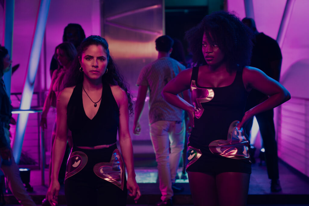 M.I.A. -- "Familiar Faces" Episode 104 -- Pictured: (l-r) Shannon Gisela as Etta, Brittany Adebumola as Lovely -- (Photo by: Jeff Daly/PEACOCK)