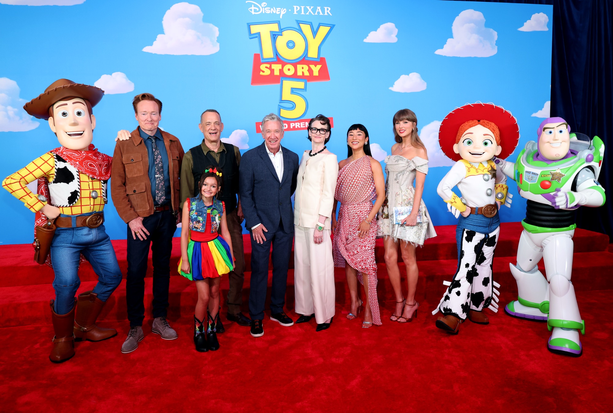 LOS ANGELES, CALIFORNIA - JUNE 09: (EDITORIAL USE ONLY. NO STANDALONE PUBLICATION USE. NO SPECIAL INTEREST OR SINGLE ARTIST PUBLICATION USE; NO BOOK USE) (L-R) Conan O'Brien, Scarlett Spears, Tom Hanks, Tim Allen, Joan Cusack, Greta Lee and Taylor Swift attend the Toy Story 5 Los Angeles World Premiere at Dolby Theatre in Los Angeles, California on June 09, 2026. (Photo by Kevin Mazur/Getty Images for for TAS Rights Management)