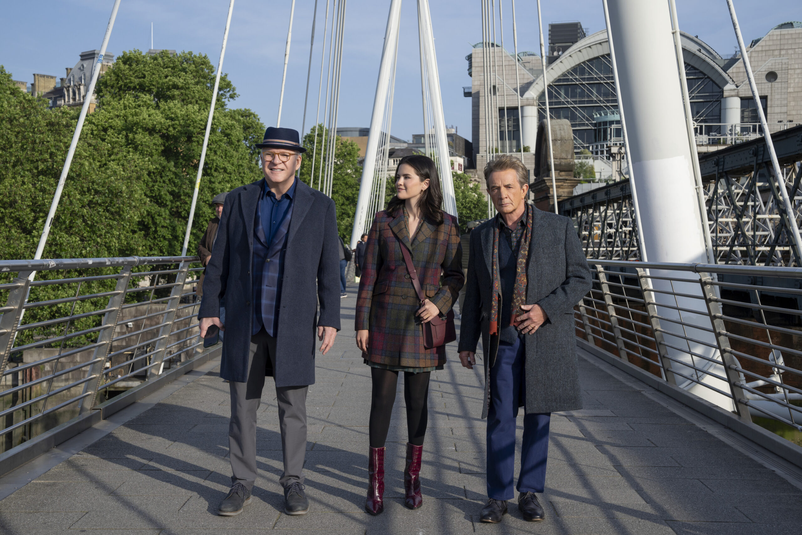 ONLY MURDERS IN THE BUILDING - Season 6 - “First Look” - After successfully bringing the guilty to justice once again, Charles, Oliver and Mabel embark on their hardest case yet when the next victim — Cinda Canning — arrives at their doorstep, summoning them to London to catch her killer. Our beloved trio of true crime-solving podcasters must now navigate their way through the home of the cozy murder mystery, replete with a whole new collection of suspicious and particularly English-eccentric characters. But can they follow in the footsteps of the woman whose podcast started it all for them … without having their story end the same as hers? (Disney/Miya Mizuno) STEVE MARTIN, SELENA GOMEZ, MARTIN SHORT